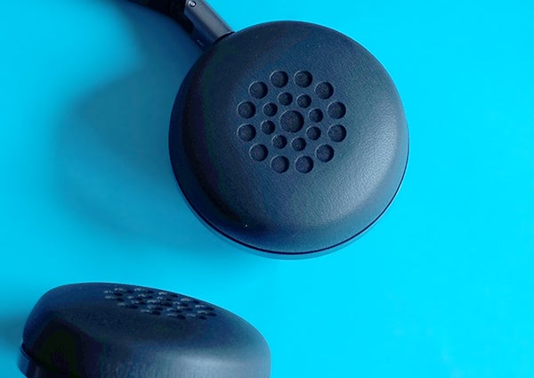 Philips Fidelio NC1 headphones on blue background.