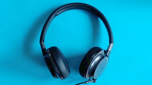 Philips Fidelio NC1 headphones on a blue background