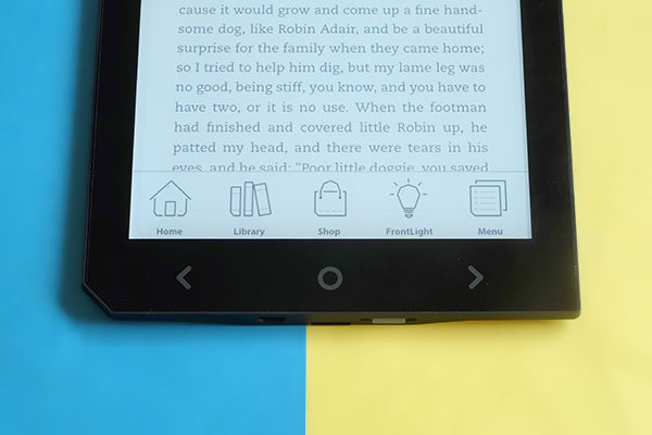 Cybook Ocean e-reader displaying text with navigation icons visible.