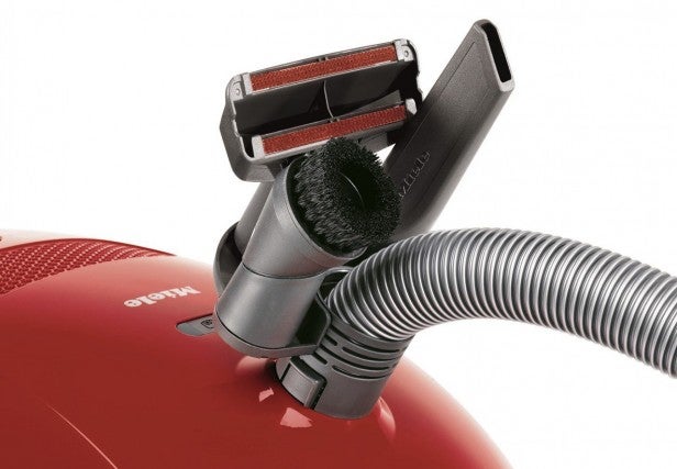 Miele Compact C2 vacuum with attached cleaning tools.