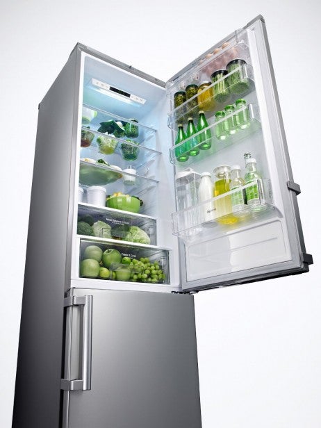 LG GBB530NSCFE fridge freezer filled with food and drinks.