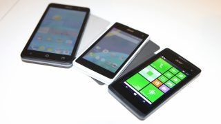 Three Acer Liquid M220 smartphones displayed side by side.