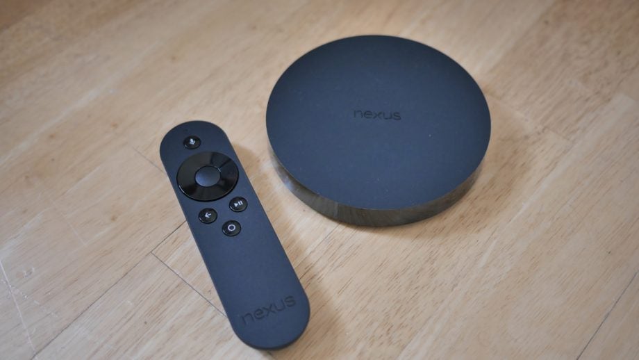 Nexus Player and remote on wooden surface.