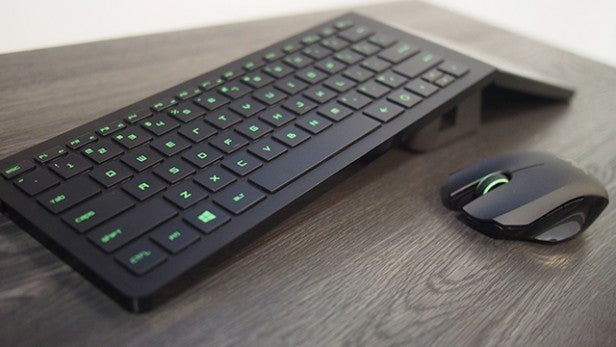 Razer keyboard and mouse on wooden surface.Razer keyboard and mouse on wooden desk.
