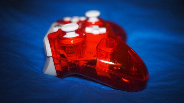 Red Rock Candy Wired Xbox One Controller on blue background.