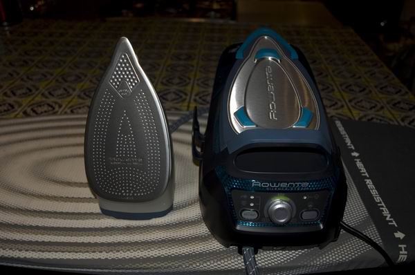 Rowenta Silence Steam iron and base on an ironing board.