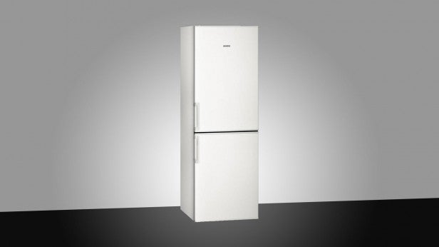 Siemens KG30NVW20G white fridge freezer in studio setting.