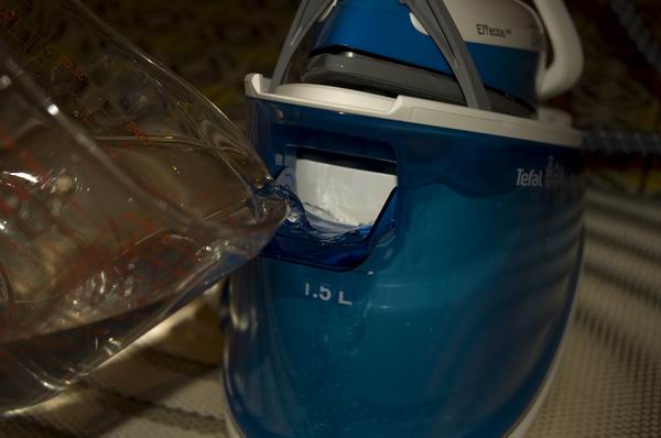 Pouring water into Tefal Effectis GV6760 steam generator iron.