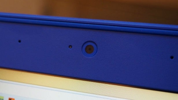 Close-up of blue laptop hinge and webcam.