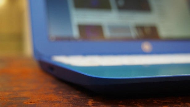 Close-up of a blue HP Stream 11 laptop on a table.