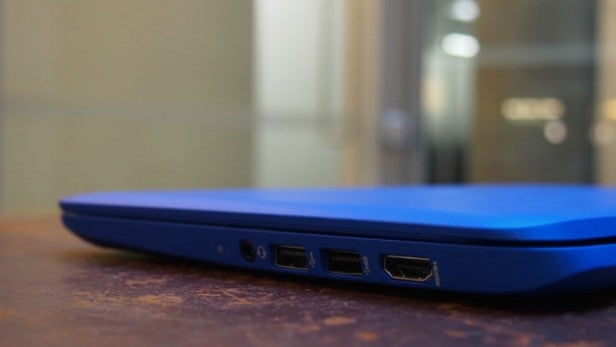 Side view of a blue laptop showing ports for connectivity.