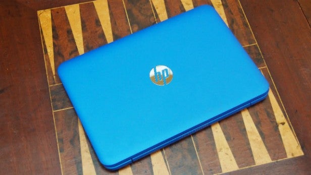 HP Stream 11 laptop closed on wooden table.