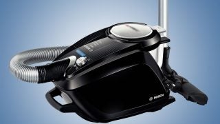 Bosch BGS5SIL2GB GS50 PowerSilence vacuum cleaner on blue background.