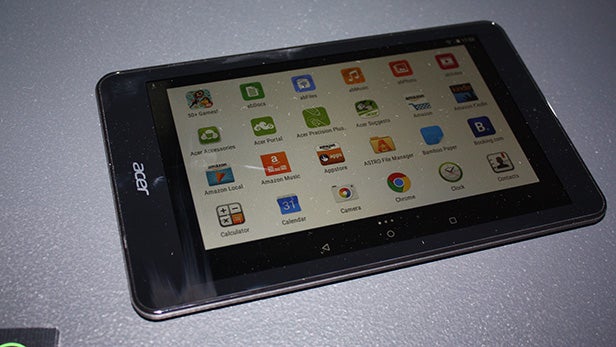 Acer Iconia One 8 tablet displaying colorful app icons.