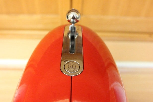 Close-up of red Smeg SMF01 stand mixer's speed control lever.