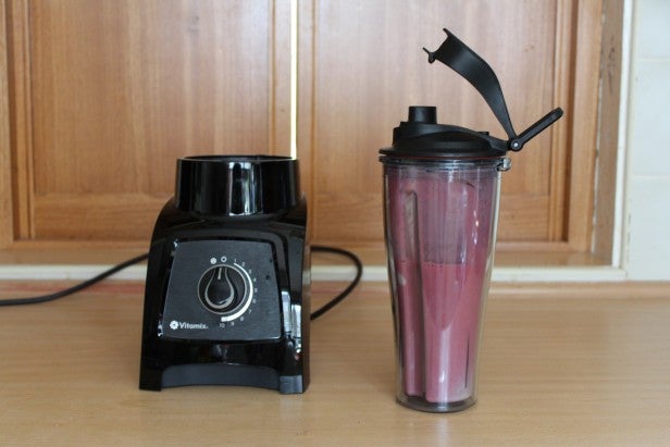 Vitamix S30 blender with a smoothie in travel cup.