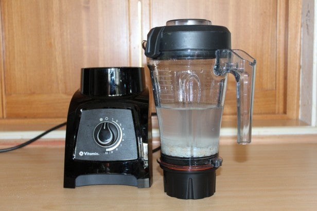 Vitamix S30 blender on kitchen counter with mixture.