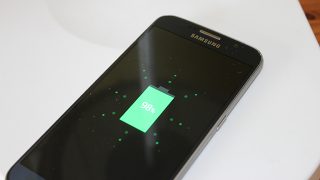 Samsung phone displaying 98% battery charge on screen.
