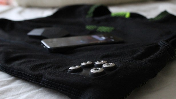 OMSignal biometric shirt with electronics and mobile phone
