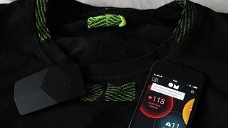 OMsignal biometric smart shirt with mobile app showing heart rate.