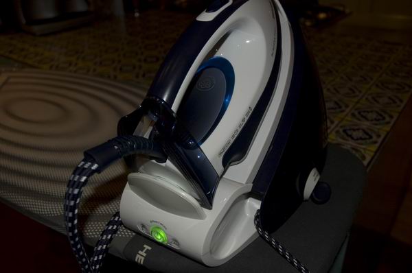 Philips PerfectCare Expert GC9222 steam iron on stand.