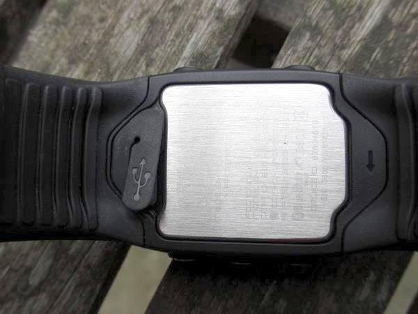 Polar M400 sports watch on a wooden surface.