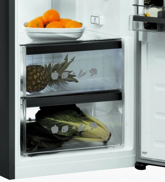 Whirlpool refrigerator's crisper drawers with fruits and vegetables.