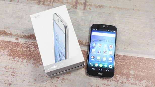 Acer Liquid Jade smartphone and its box on a table.