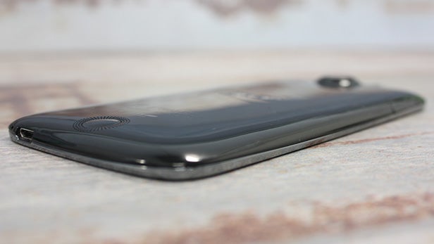 Black Acer Liquid Jade smartphone lying on table.