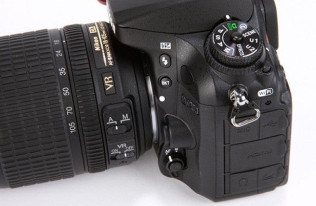Close-up of Nikon D7200 DSLR camera with lens attached.