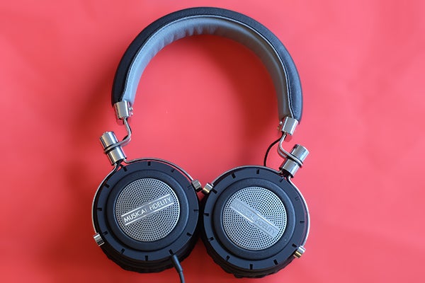 Musical Fidelity MF-200 headphones on red background.