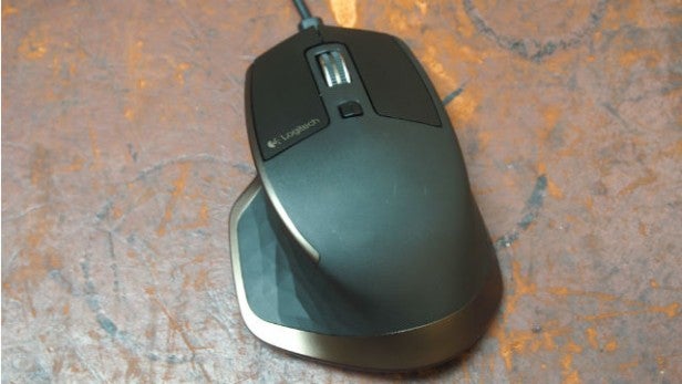Logitech MX Master wired mouse on textured surface.