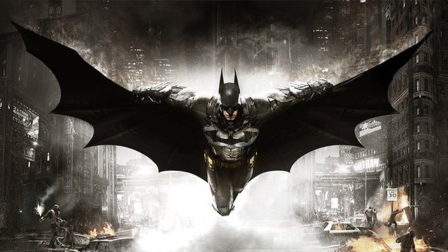 Batman gliding over a chaotic Gotham cityscape.