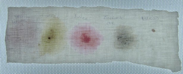 John Lewis JLWM1205 4Stain removal test strip with annotated results.
