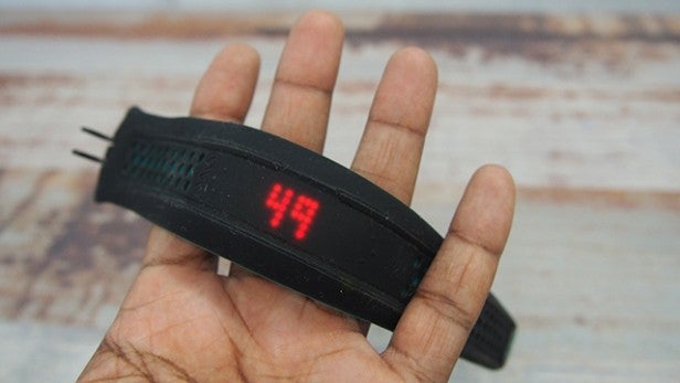 Mio Fuse heart rate monitor on a person's palm.