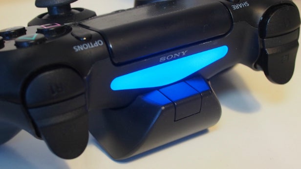 PS4 controller with Venom rechargeable battery pack attached.