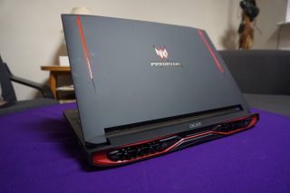 Acer Predator 17 gaming laptop on a purple surface.