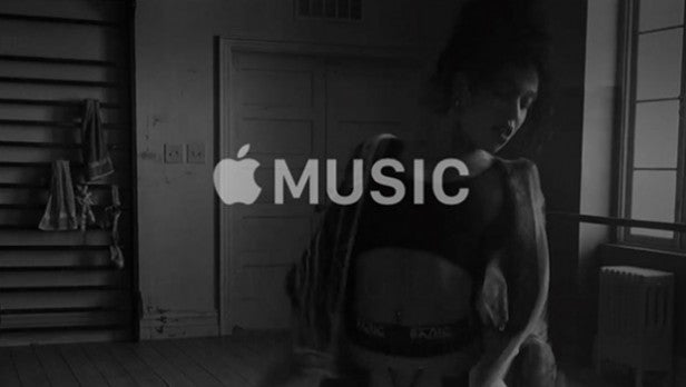 Apple Music logo in a black room