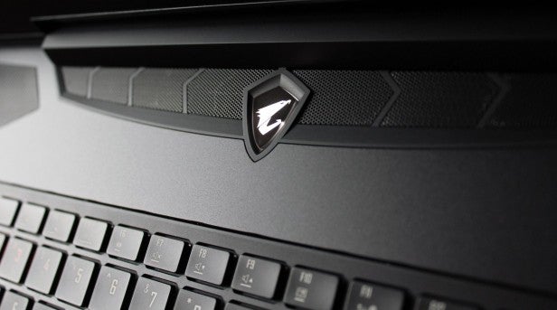 Aorus X7 V6 5Close-up of laptop keyboard and brand logo on hinge.