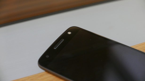 Moto ZSmartphone on table highlighting front-facing camera and screen.