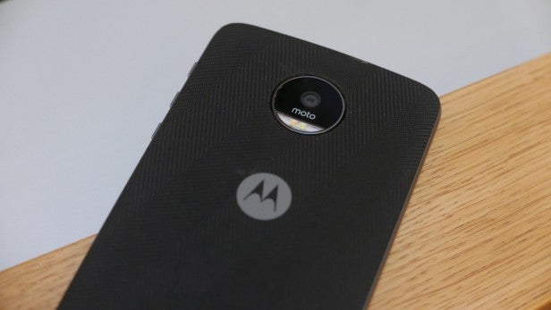 Moto ZBack view of a Motorola smartphone on a wooden surface