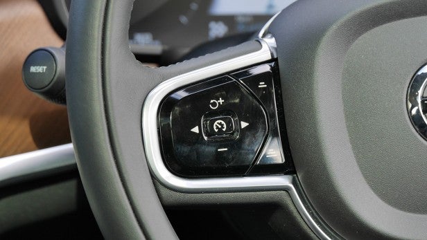 Volvo V90 9Close-up of Volvo V90 steering wheel controls.