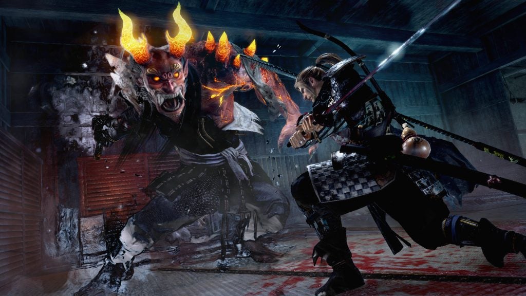 Screenshot from the game Nioh showing a character battling a fiery demon.
