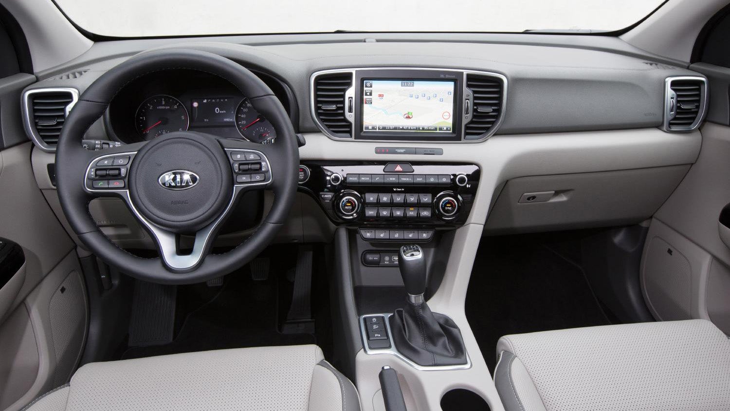 Interior view of Kia Sportage dashboard and steering wheel