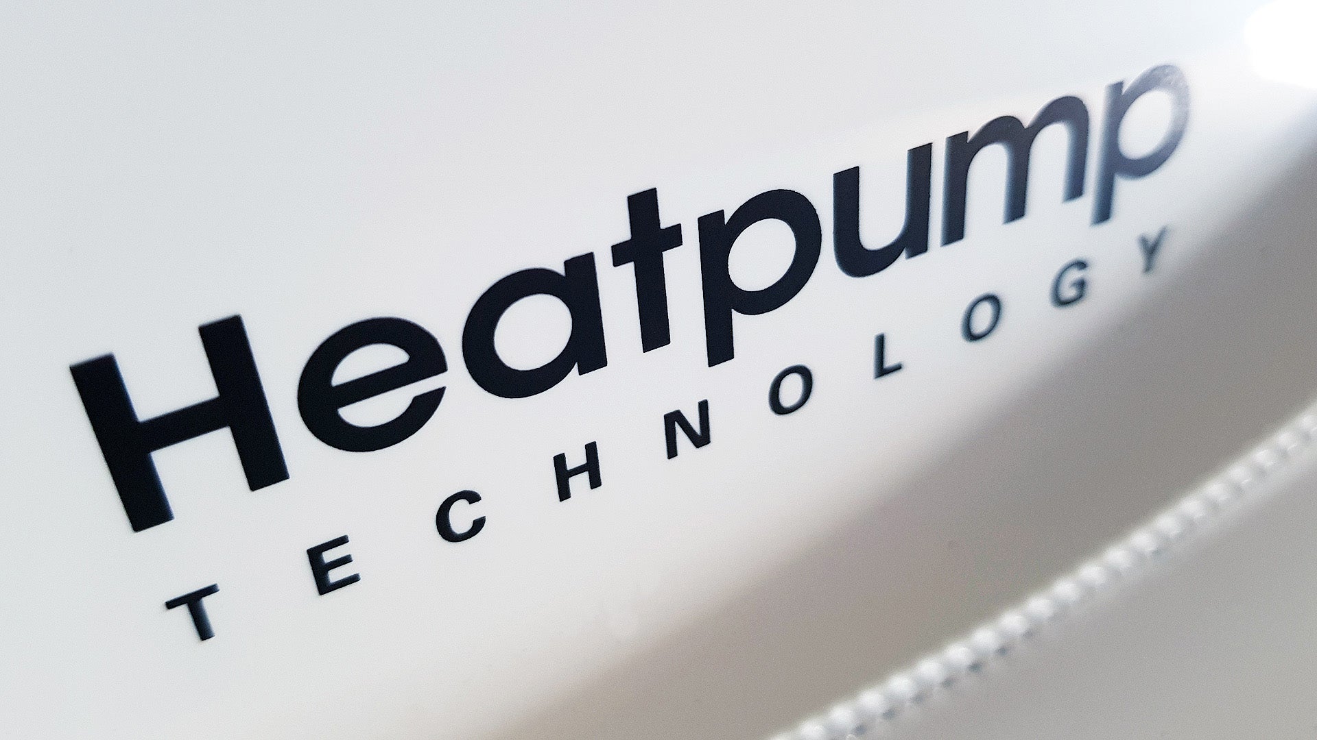 Close-up of Samsung dryer's Heatpump Technology logo.