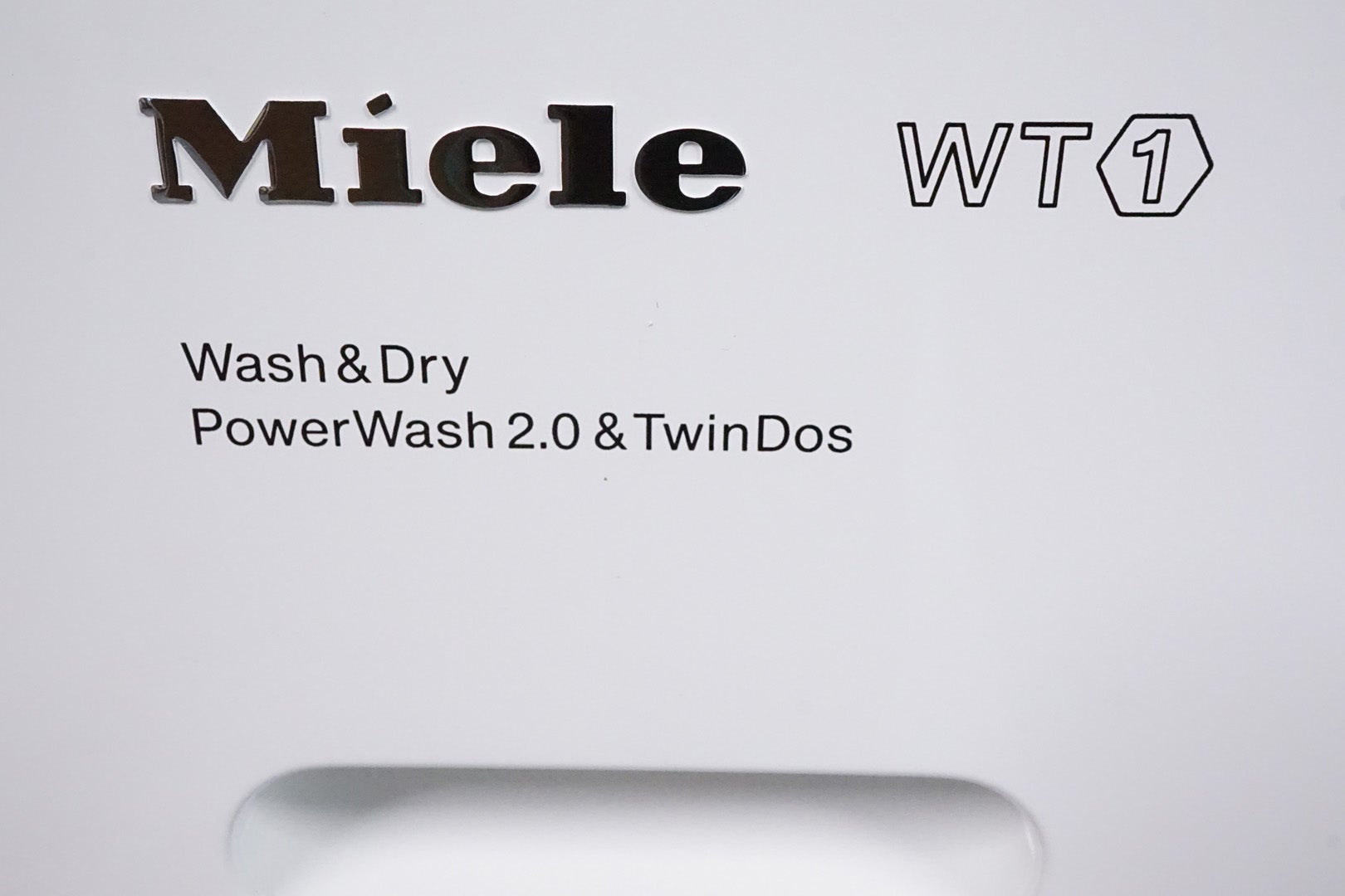 Miele WTH120 washer-dryer logo with PowerWash and TwinDos features.