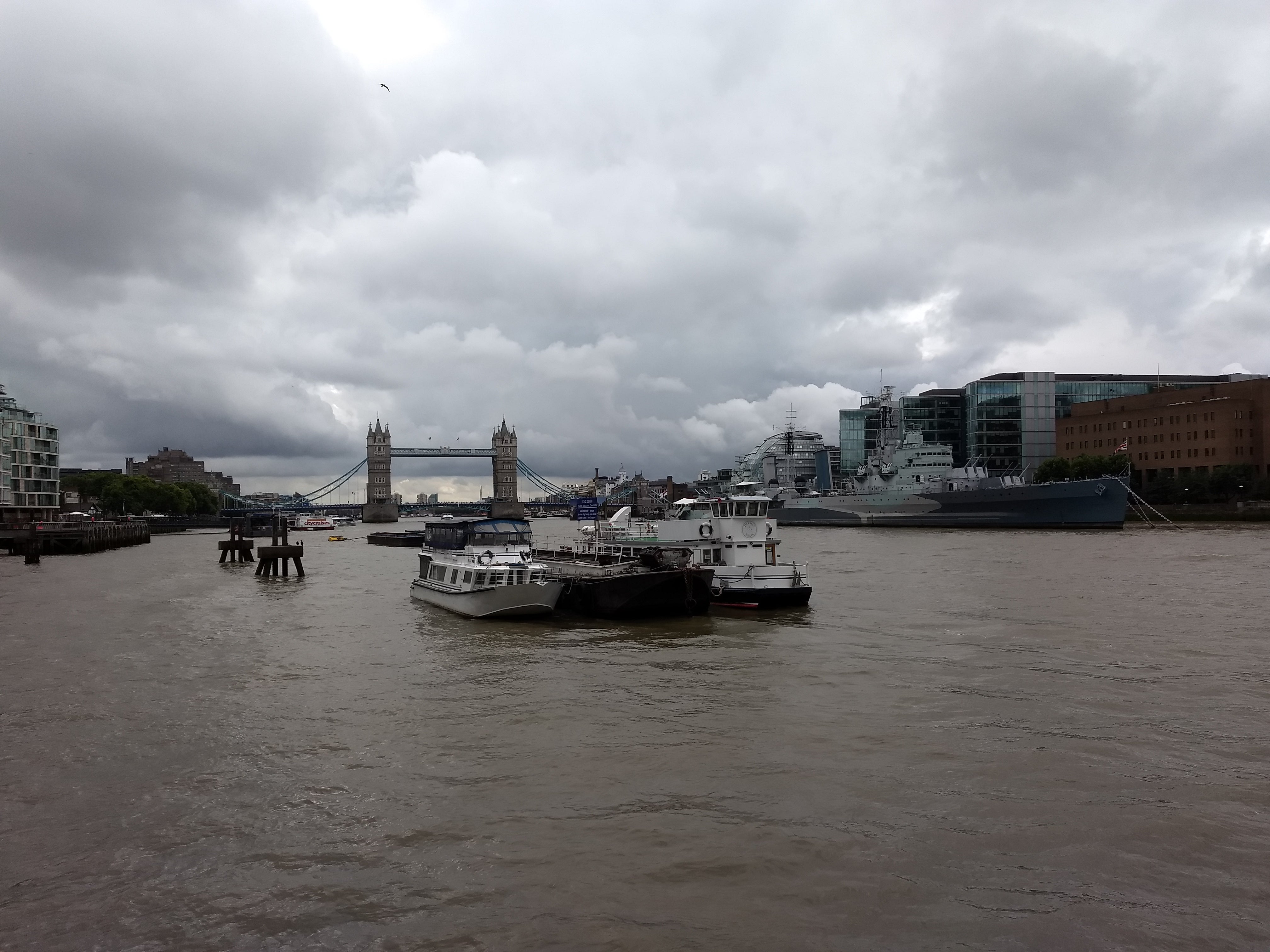 Cloudy sky over Thames River with Tower Bridge in the background