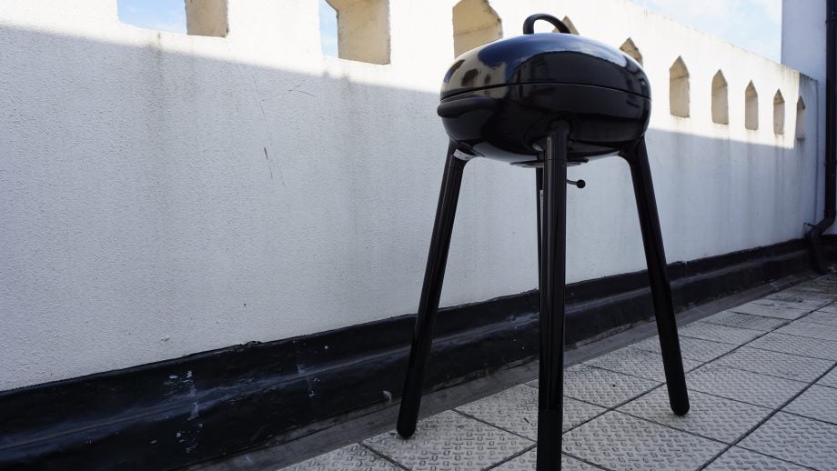 Ikea LILLÖN charcoal grill on an outdoor patio.