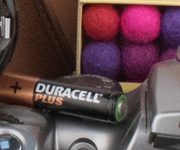Close-up of a Duracell battery with colorful background