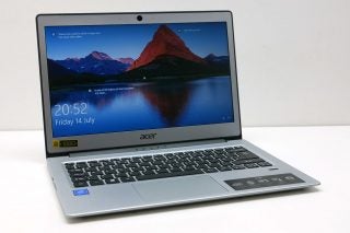 Acer Swift 1 laptop on white background displaying screen and keyboard.
